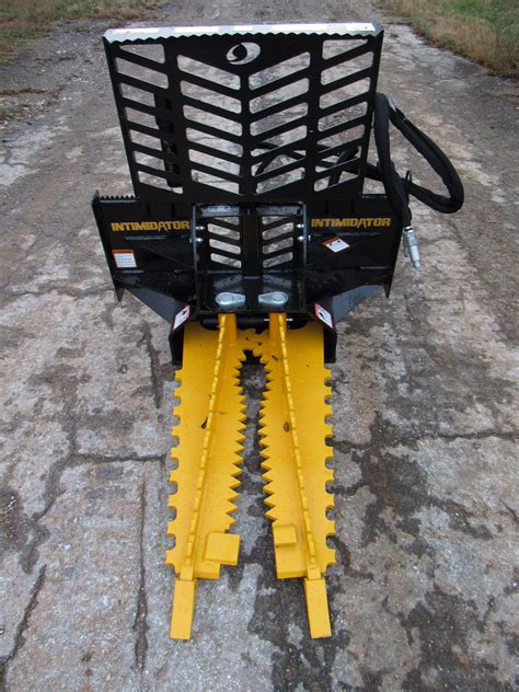 skid steer hydraulic tree puller|intimidator vs dominator tree puller.